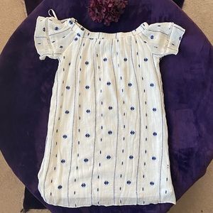 White dress with blue decorations for women.
